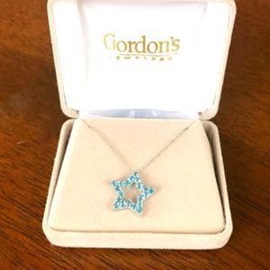 10k with gold necklace with a star blue Stones